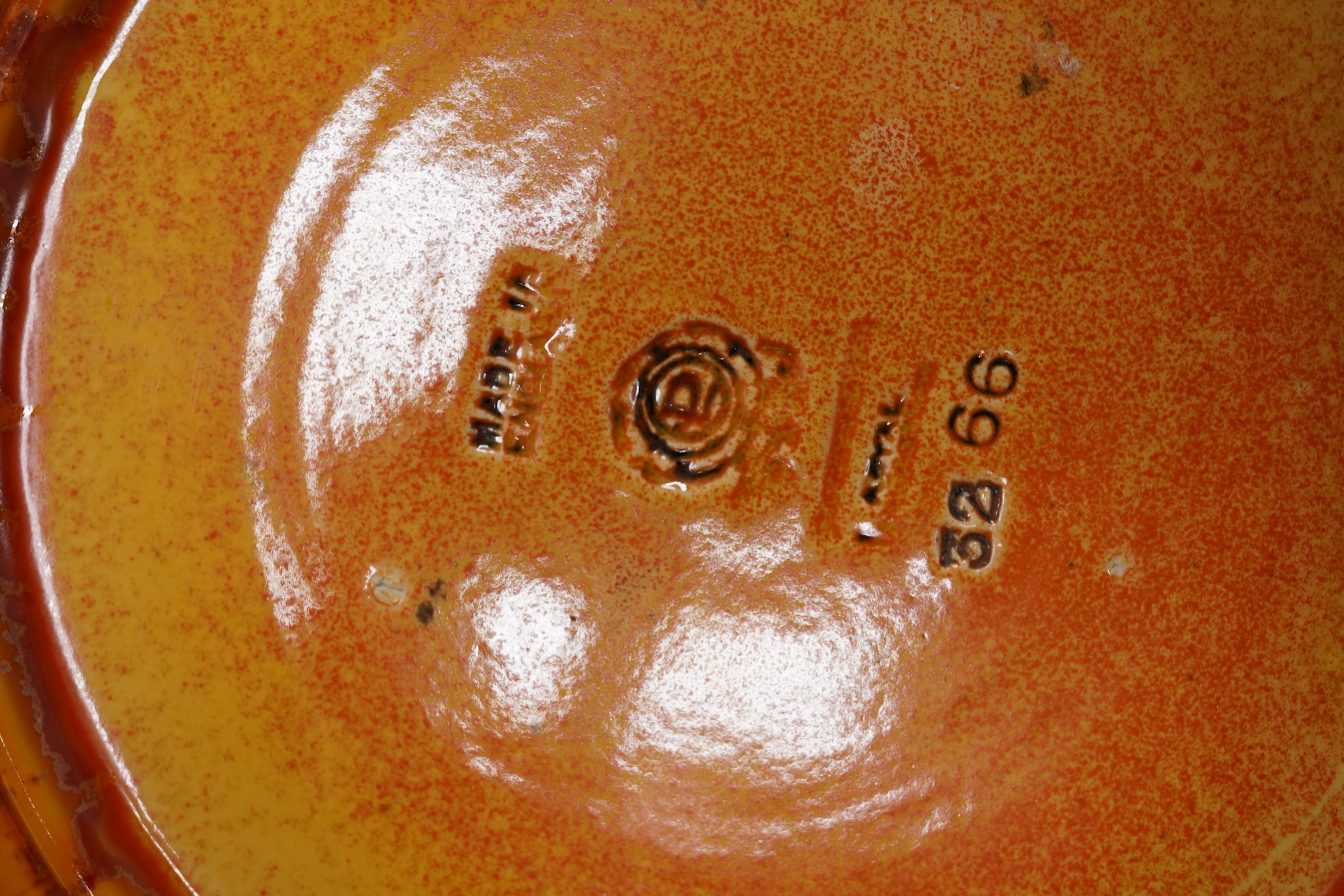 A Pilkingtons orange lustre plate, stamped to the base, 21cm in diameter